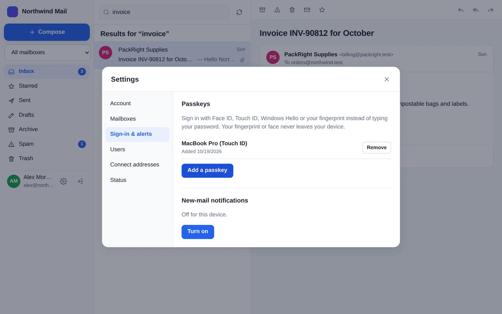 The Sign-in and alerts settings, with a Touch ID passkey added and new-mail notifications ready to turn on.
