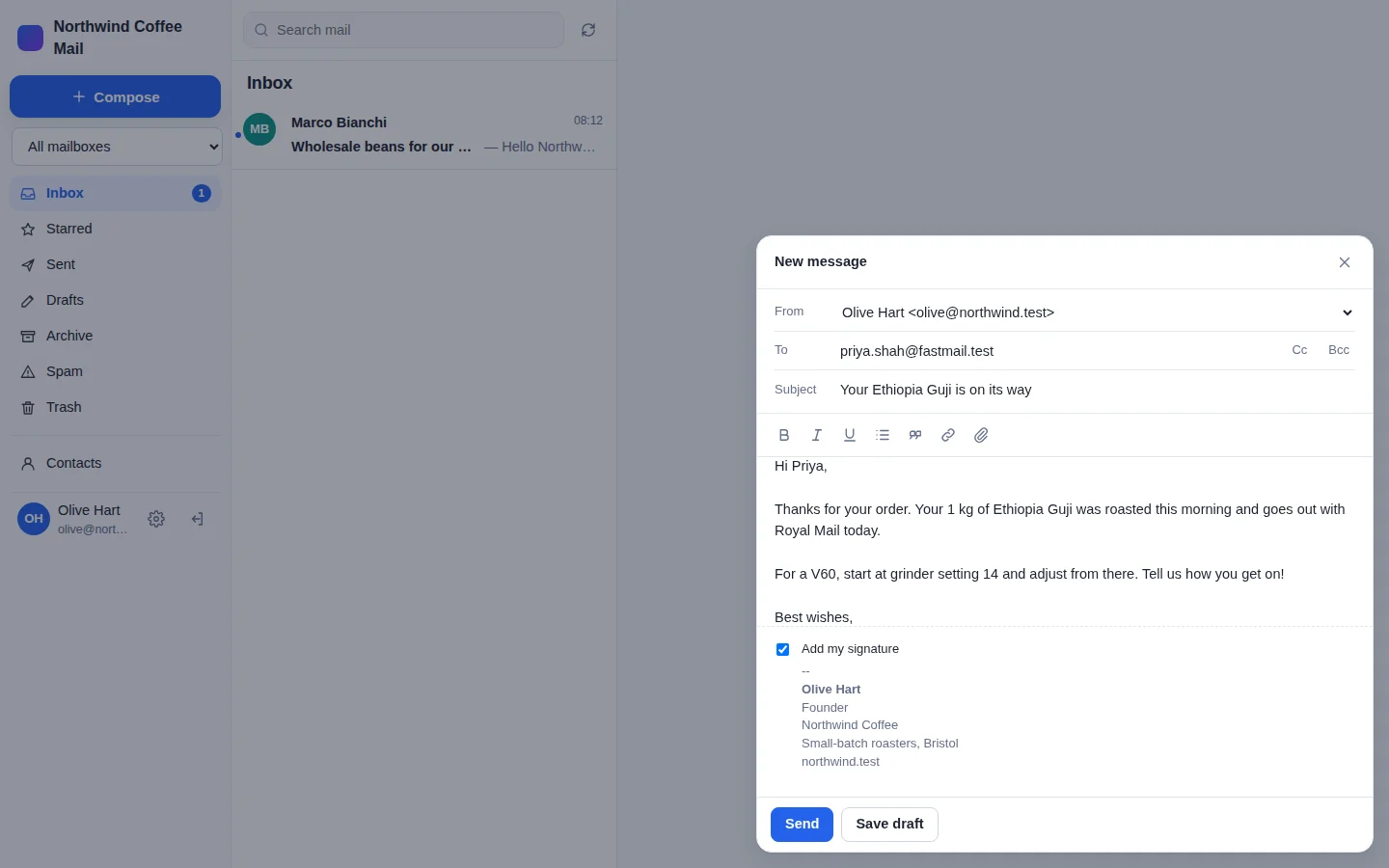 The New message window: From Olive Hart, To priya.shah@fastmail.test, the subject Your Ethiopia Guji is on its way, the message, and Olive's signature under it with Send and Save draft buttons.